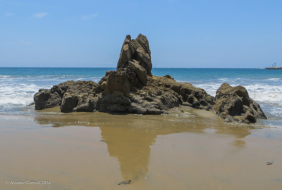 Rock reflection in sand